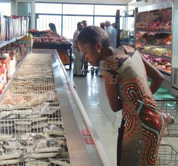 Customer checking meat section at Superior supermakert