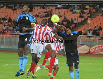 Flames and Taifa players battle for the ball.-Photo by Mohamed Mambo