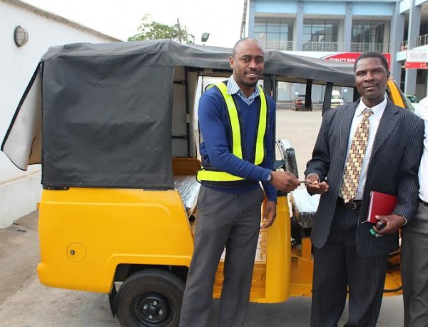 TNM present tricycle to the winner in Tikolore Promotion