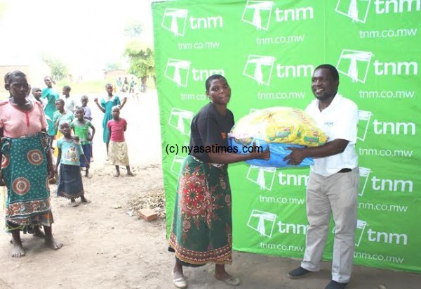TNM official presents the relief items