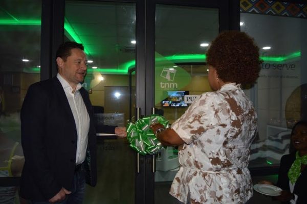 TNM's Stevenon and Minister of Information Kaliati opening the VIP suite