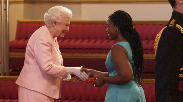 Tanya Daringo accepts her award from The Queen