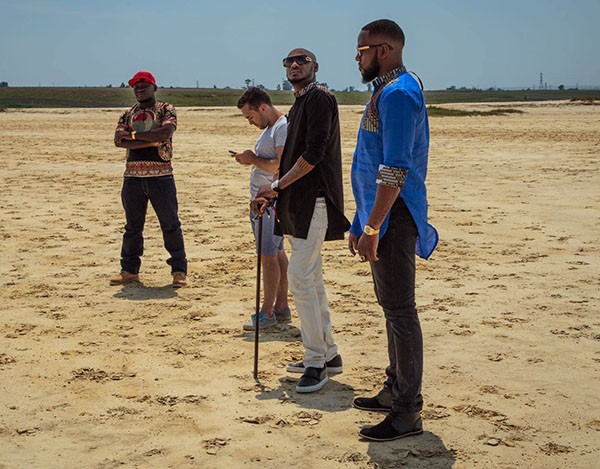Tay Grin (right) with 2Baba and crew during the shoot. Photo – Tay Grin