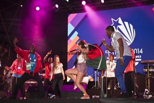 Team Malawi dancing on stage as Tay Grin with YADi. Photo by Jannica Honey.