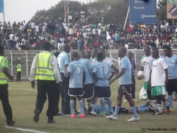 Tension after Silver players was hit by Mafco's Sadani Mangwere. Photo by Elijah Phimbi, Nyasatimes