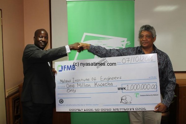 Thawe receives the cheque from TNM