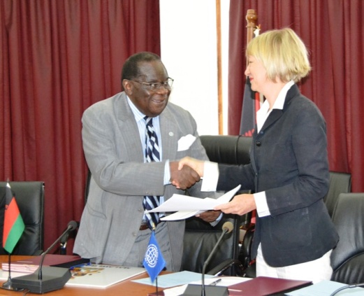 The Finance Minister Hon. Goodal Gondwe MP Exchanges documents with World Bank Country Manager Ms. Laura Kullenburg at Capital Hill in Lilongwe-Pic. by Abel Ikiloni