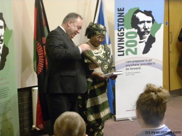 The First Minister of Scotland presents a gift of a book to Malawi President Joyce Banda at Livingstone Memorial Centre Blantyre, Scotland