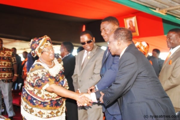 The Leader of Opposition and President of the MCP John Tembo in  handshake with President Banda at a public function=