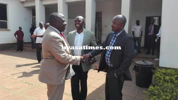 The MCP officials share jokes outside court.- Photo by Mphatso Nkhoma, Nyasa Times