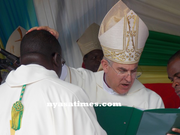 The Nuncio blessing Bishop Tambala...Photo Jeromy Kadewere