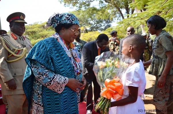 The President meets a Flower Girl at Chilumba Barracks