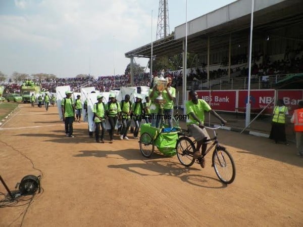 The TNM Super League trophy arrives at Civo on a bicycle, Pic Alex Mwazalumo.