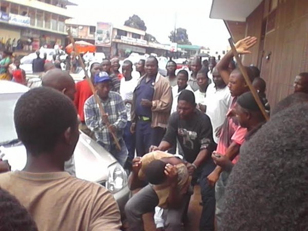 The alleged thief being beaten by an angry mob - pic by LINA