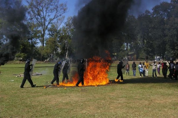 The trained police officers walk through the fire during the symbolic event.