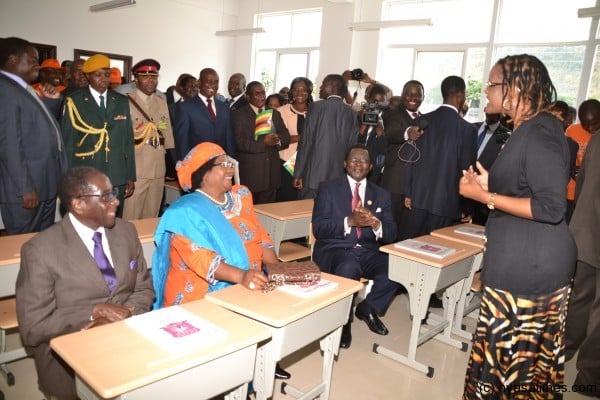 Top of the class: Malawi President Joyce Banda and Zimbabwe’s Mugabe  pictured in  classroom in Harare being ‘taught’ by First Lady Mrs Mugabe