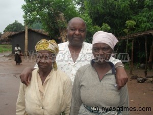 Secular humanist George Thindwa posing with the two "witches" freed from jail. Liviness Elifala, 51 and her friend Margaret Jackson who looks 70 of Lodzanyama village, Traditional Authority Ntema in Lilongwe