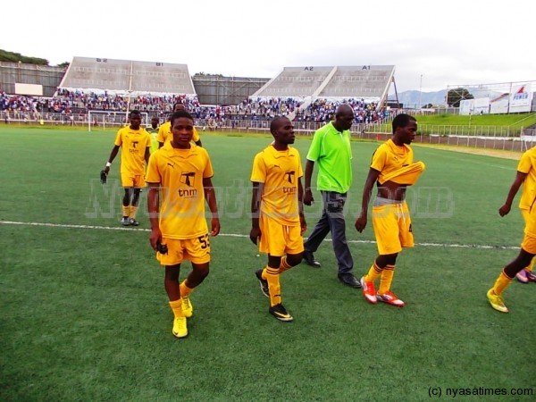Heads down: Tigers walk out of the pitch after being mauled by Nomads