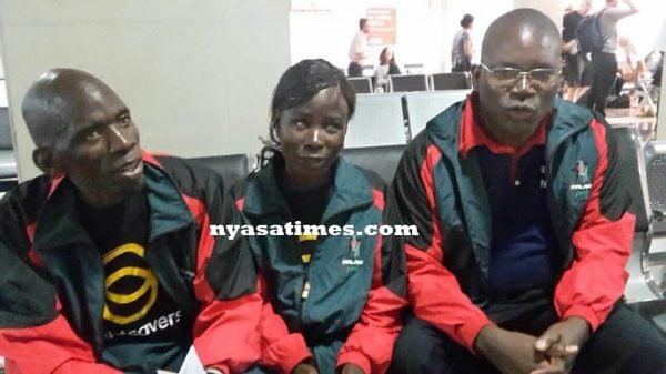 Tionere Banda (centre) flanked by Luhanga and Chiutsi before departure ar Chileka Airport
