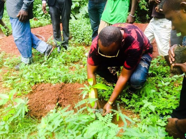 Tiwonge Mhango planting a tree