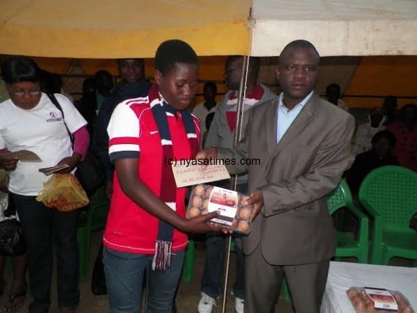 Top goal scorer Mary Chavinda from Zomba City Queens gets her prize.