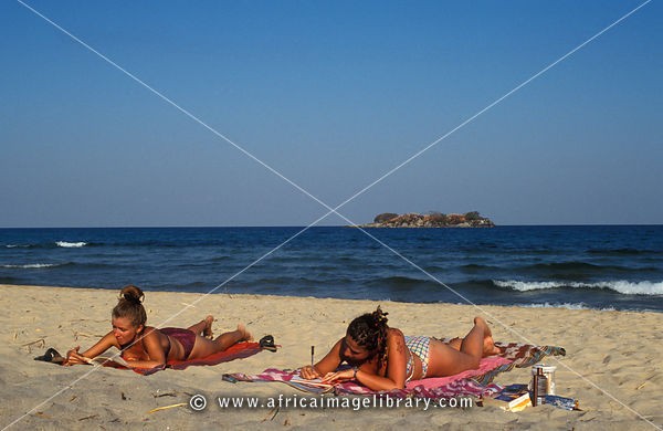 Tourists sunbathing on the beach, Kande beach, Lake MalawI