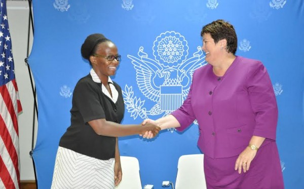 US Ambassador Virginia Palmer congratulates one  of a beneficiary group