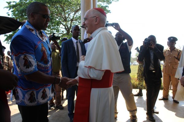 Vice President Chilima greets Cardinal Filoni.