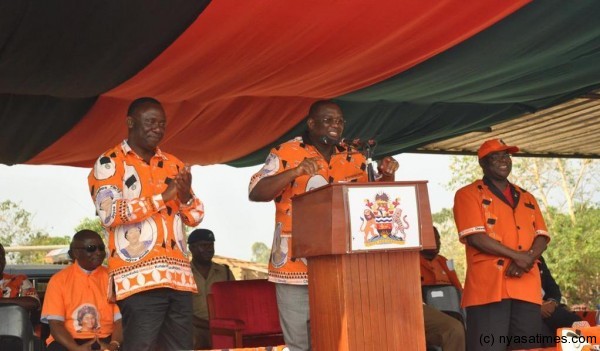 Vice President  Kachali calls for peace as he introduces  incumbent MP for Karonga Central, Cornelius Mwalwanda (right) and his contendor Frank Mwenefumbo.-Photo by Frank Nkondetseni, Mana