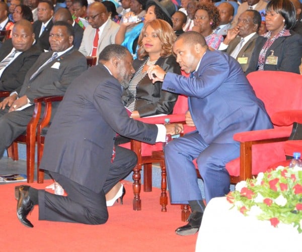 Vice President Saulosi Chilima confers with the Minister of Labour and Man Power Henry Mussa during the launch of National Youth Conference at BICC (C) Stanley Makuti