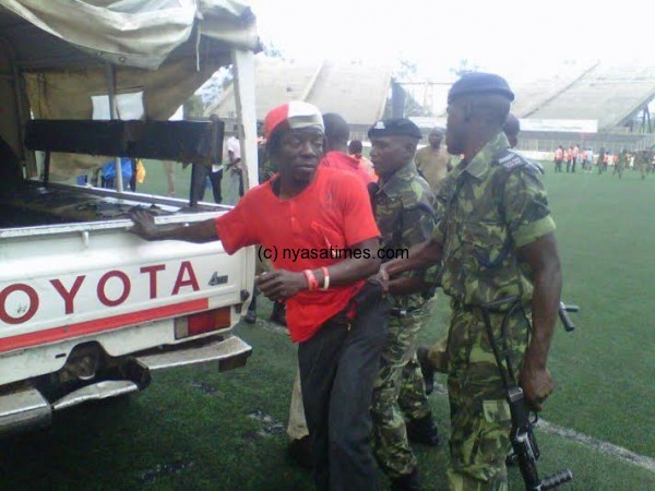 Check the colours he is putting, the ganyu supporter arrested.-Photo by Jeromy Kadewere