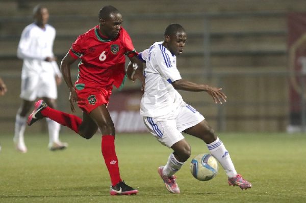 Malawi player chase the ball from Namibian