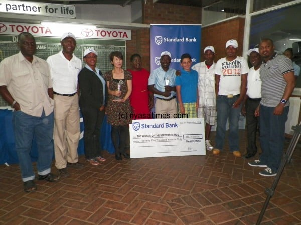 Winners' pose- the winners pose with Standard Bank officials