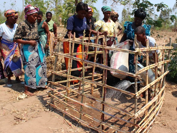 Women making manure after being drilled by WVI...Photo Jeromy Kadewere