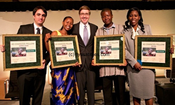 World Food Prize 40 Chances Fellows Emiliano Mroue, Lilian Uwintwali, Mahmud Johnson and Bettie Kawonga, with Howard G Buffett. Photograph: Jim Heemstra/World Food Prize
