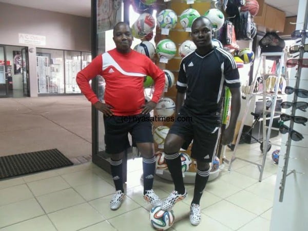 Zodiak's Mike Bango (left) and Daily Times corresondent Mabvuto Kambuwe wear the new kit