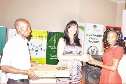 Maltilda Chimwaza receiving the Best ICT Journalist of the Year award on behalf of Malawi News editor Charles Mpaka