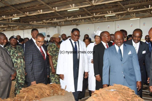 President Mutharika, vice president Saulos Chilima and Minister of Agriculture at the tobacco auction floors