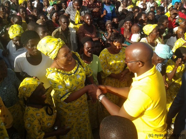 Atupele grreting UDF supporters at Dzaone