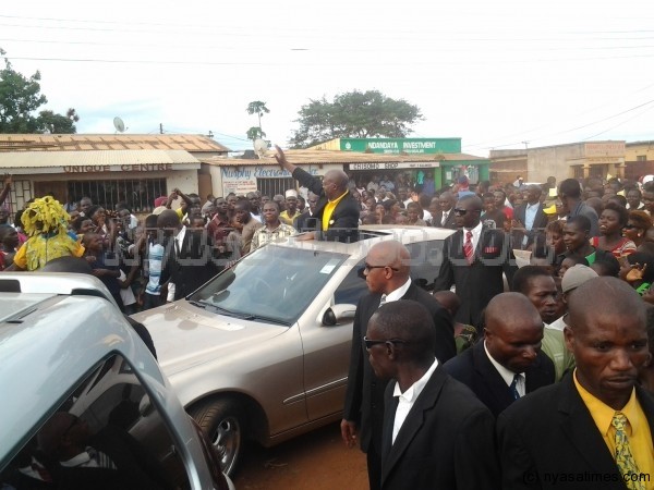 Atupele waving supporters as his motorcade passes through in Lilongwe townships during whistle-stop