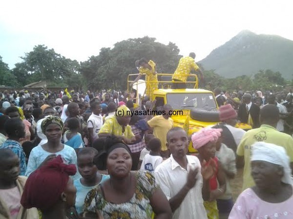 Atupele accompanied by his wife Angella in Kasungu