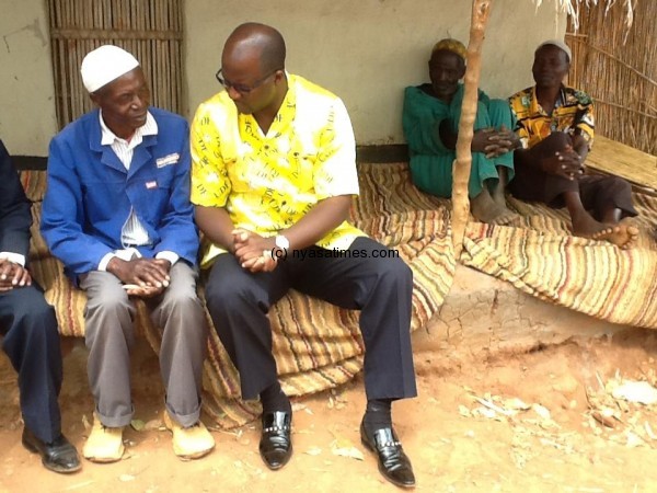 Atupele having  a conversation with a villager