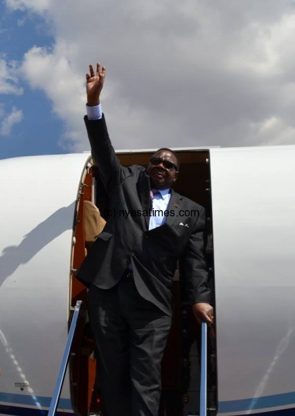 I'm back: Mutharika on arrival.-Photo by Mana