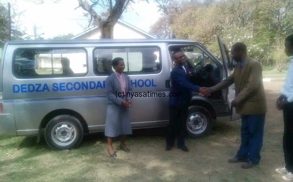 Ben Phiri handing over the minibus to Dedza Secondary School