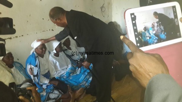 Former president Muluzi (on his birthday) attended the funeral and here is seen comforting the bereaved