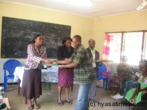 Care giver receiving a certificate after the training