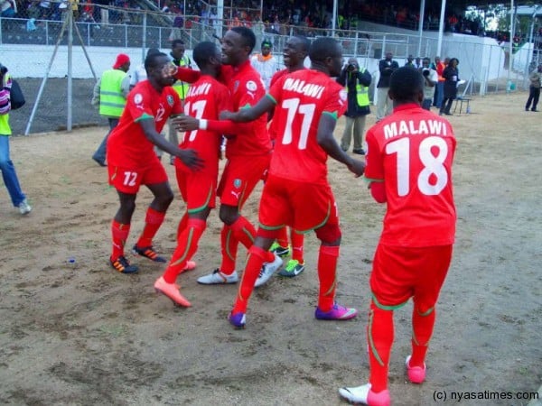 Malawi players celebrate lead buu finished the game disapointed after a frustrating draw.-Photo by Jeromy Kadewere/Nyasa Times