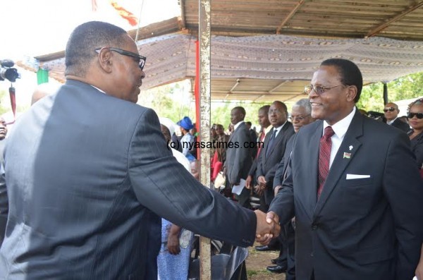Unity of purpose: President Mutharika greets opposition leader Chakwera at the function