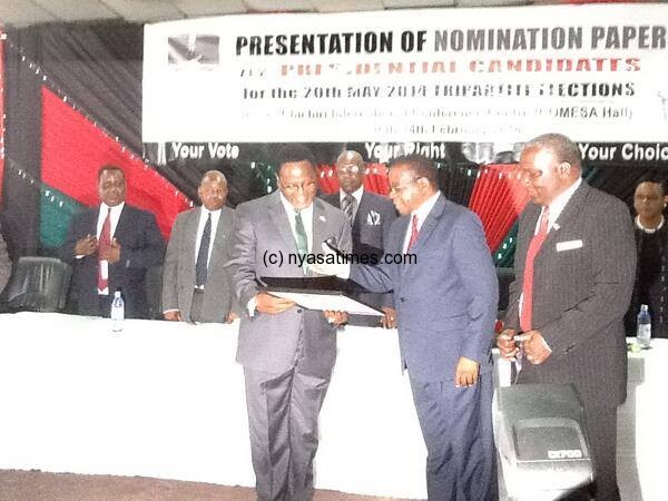Chakwera receving a certificate of candidacy from MEC
