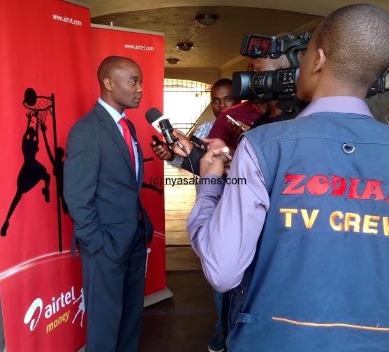 Airtel Chief Commercial Officer Charles Kamoto being interviewed by journalists 